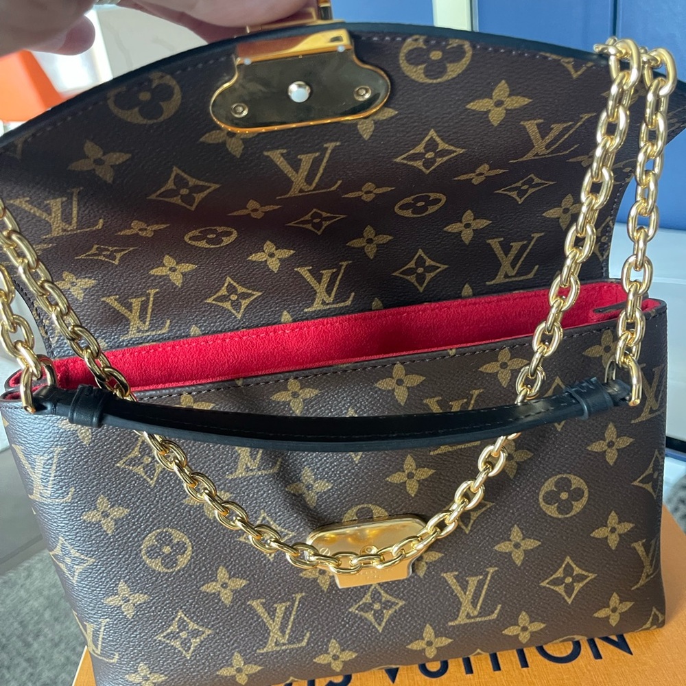 Beautiful Louis Vuitton clutch bag with the soldier stripe on it